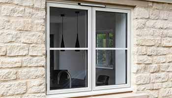 white aluminium window with centre Georgian bar