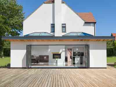 large aluminium bifold doors opening outwards in anthracite grey