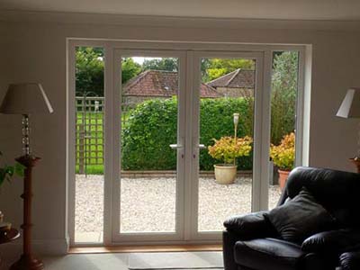 white upvc french doors with side panels