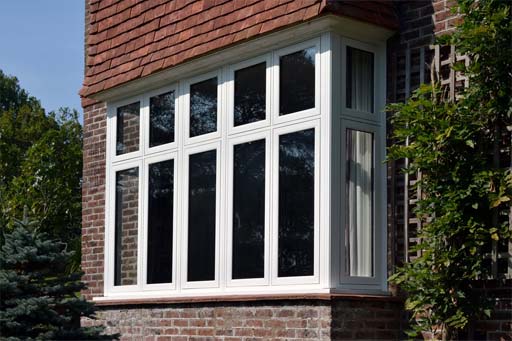 white upvc flush casement windows on a traditional style property