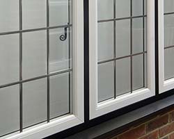 white flush sash windows in black frames