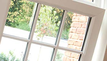 white inwards opening windows with georgian bars